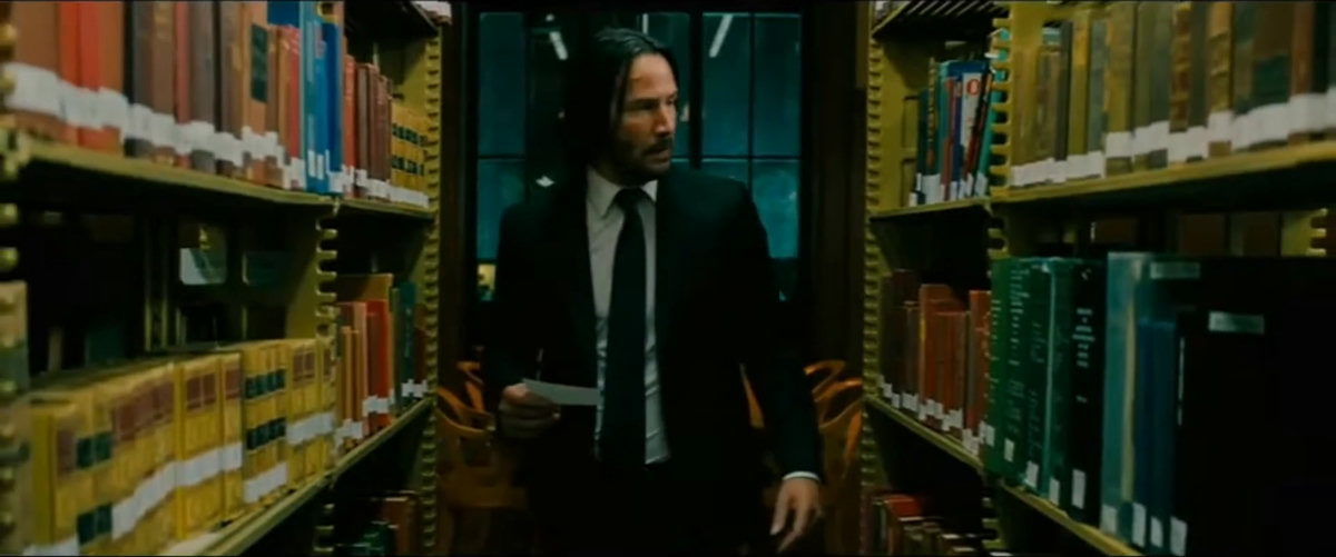 books, bookshelves, paper, window, tense, serious, focused, mysterious, standing, looking, searching, holding paper