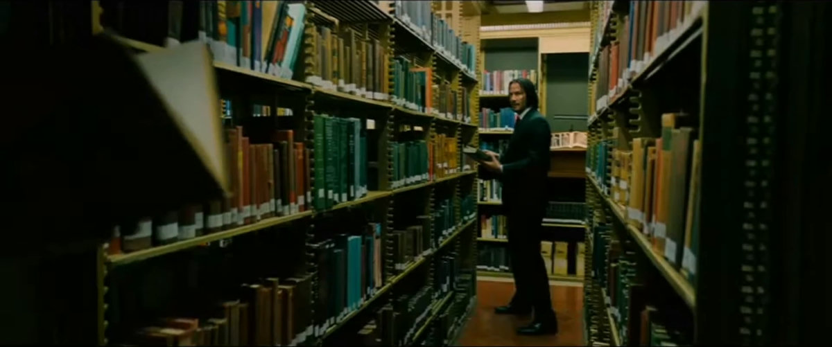 books, bookshelves, paper, window, tense, serious, focused, mysterious, standing, looking, searching, holding paper