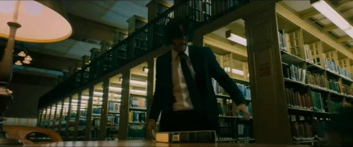 books, bookshelves, paper, window, tense, serious, focused, mysterious, standing, looking, searching, holding paper